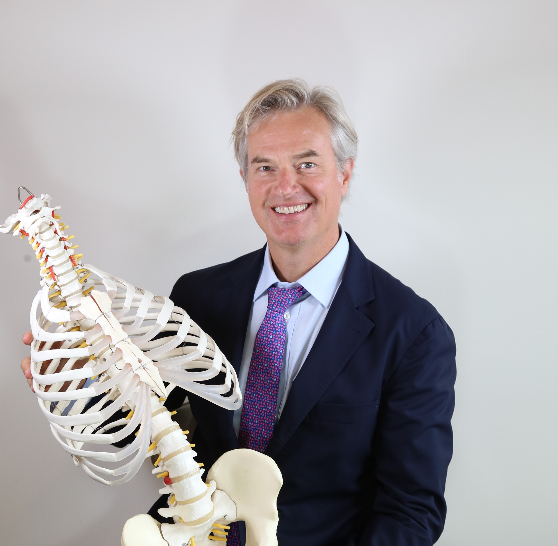 Frank Johann Schwab, MD, with an anatomical spine model